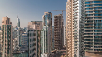  Aerial view on Dubai Marina skyscrapers and the most luxury yacht in harbor timelapse, Dubai, United Arab Emirates