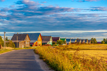 The Colorful Houses Countryside Settlement. Private Houses. Rest Outside The City On Vacation.  Cottage Settlement On A Sunny Summer Day. Cottages For Rent And Construction.