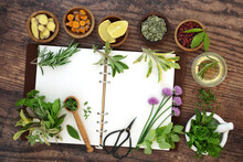 Spice And Herb Collection. Fresh Food Home Grown Local Produce Seasoning With Open Recipe Notebook And Mortar. Herbs Also Used In Herbal Plant Medicine. On Rustic Wood. Top View, Flay Lay.