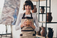 Photo Of Skilled Successful Potter Lady Hold Porcelain Dishware Shape Client Shop Order In Occupation Workroom