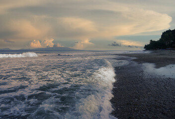 Wall Mural - Taal volcano, the Philippines. Sunrise eruption of volcanic gasses. Seen from Aninuan beach, Oriental Mindoroo