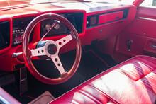 The Interior Of A Red Classic Car Or Muscle- Car
