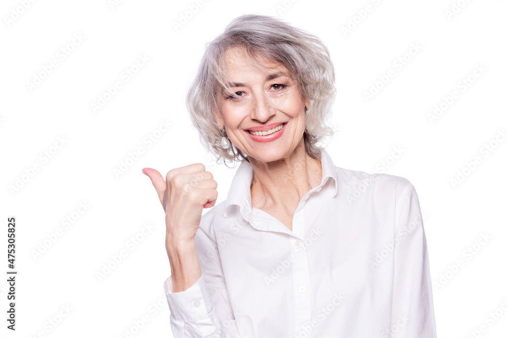 Close up portrait of a happy smiling mature woman in her sixties with ...