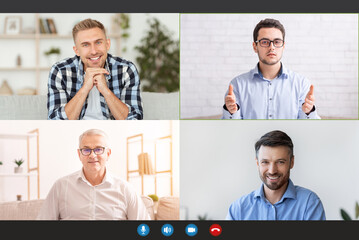 Wall Mural - Monitor screen with cheerful men having group video chat, speaking to each other via internet