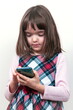 © gmstockstudio - Little child girl with the phone
