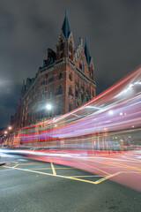 Canvas Print - Vertical shot of the night street with light trails.