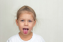 Isolated Funny Child Sticking Out Tongue On White Background