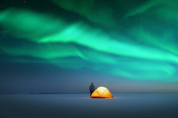 Wall Mural - tourist near yellow tent lighted from the inside against the backdrop of incredible starry sky with 