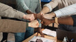 © Prostock-studio - Portrait of diverse business people giving fist bump in circle