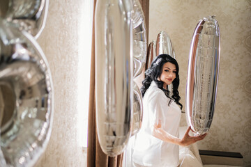 Wall Mural - morning of the bride. Beautiful brunette woman in the balloon room.