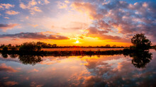 River Thames Sunset In Farmoor, Oxfordshire With Fields