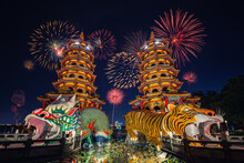The Dragon And Tiger Pagodas (Lotus Lake, Kaohsiung, Taiwan) With Fireworks During Chinese New Year's Celebration
