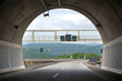 canvas print picture - Autobahntunnel, Blick von der Fahrbahn aus dem Tunnel