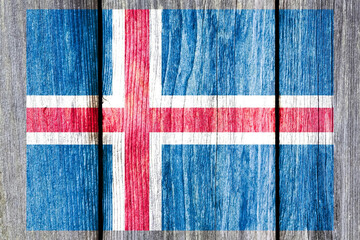 Poster - Grunge pattern of Iceland national flag isolated on weathered wooden fence board.