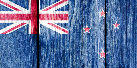 Poster - Grunge pattern of New Zealand national flag isolated on weathered wooden fence board.