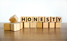 Honesty Symbol. The Concept Word Honesty On Wooden Cubes. Beautiful Wooden Table, White Background, Copy Space. Business And Honesty Concept.