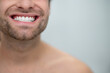 © zinkevych - Close up picture of a man showing his teeth