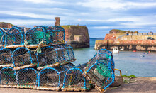 Closeup Shot Of Fishing Crates On A Pier In Dunbar Harbour