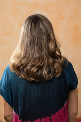 Wall Mural - Brunette woman with straight hair curly ends haircut