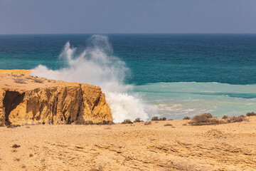 Sticker - Middle East, Arabian Peninsula, Oman, Al Batinah South. Breaking surf along the rugged coast of the Arabian Sea.