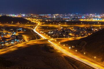 Poster - Middle East, Arabian Peninsula, Oman, Muscat, Bawshar. Night view of roads in Muscat.