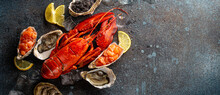 Seafood Assorted Plate With Cooked Red Whole Lobster, Fresh Open Oysters, Black Caviar, Salmon Tartare With Lemon Wedges And Ice Cubes Top View Flat Lay On Blue Concrete Stone Background Copy Space