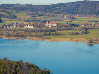 Wall Mural - View from Kesselberg mountain road towards lake Kochelsee and the foothills of the Bavarian Alps. Germany, Bavaria