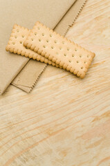 Canvas Print - bio organic biscuits on a food paper and rustic wooden background