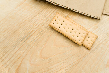 Canvas Print - bio organic biscuits on a food paper and rustic wooden background