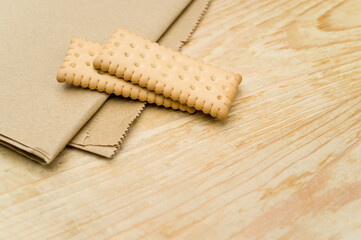 Canvas Print - bio organic biscuits on a food paper and rustic wooden background