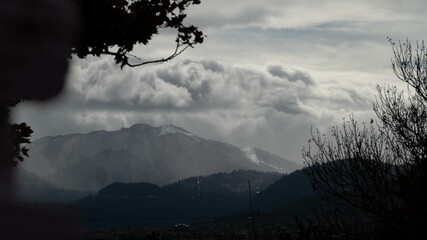 Wall Mural - cloudscape over a landscape on a gloomy day
