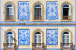 Europe, Portugal, Aveiro. Tiled facade and windows on house.