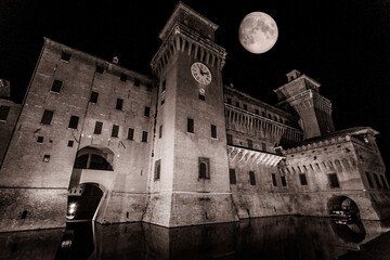 Poster - Famous old historic Este Castle against a dark sky with full moon at night