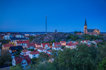 Poster - Sweden, Bohuslan, Lysekil, high angle view of the Lysekil church and town, dusk (Editorial Use Only)