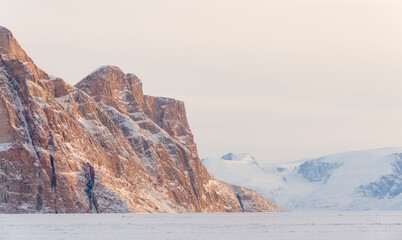 Sticker - Storen Island, frozen into the sea ice of the Uummannaq fjord system during winter. Greenland, Danish Territory