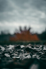 Poster - Shallow focus of rocky coastline with rocks with a blurred hazy sky