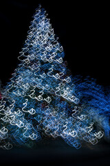 Wall Mural - USA, Arizona, Buckeye. Abstract motion of Christmas tree at night.