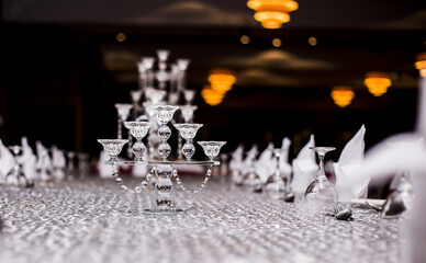 Wall Mural - Scenic view of a glass decoration on the table on a blurred background