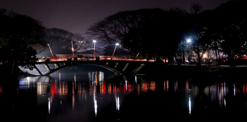 Poster - Scenic view of an illuminated bridge during the night