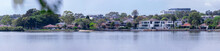 Panorama View Of Concord Bay On Sydney Harbour NSW Australia, Wealthy Houses On The Forshore Nestled Between Lush Green Trees