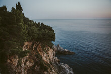 Green Cliff Facing The Peaceful Sea