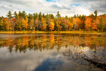 Brilliant Fall Foliage Around Morey Pond In Wilmot, New Hampshire.