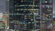 © neiezhmakov - Windows of office buildings at night timelapse, the light from the windows of houses