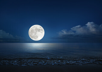 full moon over the sea with tropical beach. (elements of the moon image furnished by nasa)