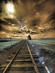 Wall Mural - USA, Washington State, Palouse. Backcountry rail Road and Silo through wheat field with clouds