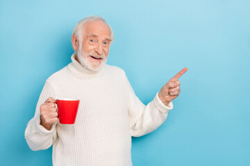 Poster - Photo of impressed elder grey hairdo man index promo hold cup wear white jumper isolated on blue color background