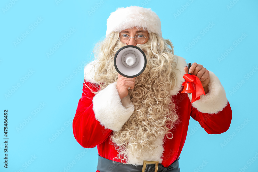 Santa Claus with megaphone and Christmas bell on blue background