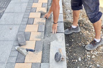 Wall Mural - Construction worker on a public road reconstruction.