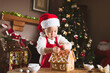 © M-image - young girl making gingerbread house at home