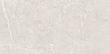 Light Beige Exquisite Marble Crema Natura. The Texture Of Natural Stone With A Uniform Pattern With Chaotic Splashes And Streaks Of Light. Building Materials For Interior Finishes.